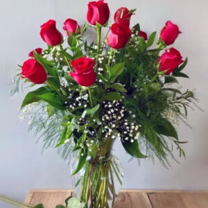 Dozen Red Roses in a vase with baby's breath